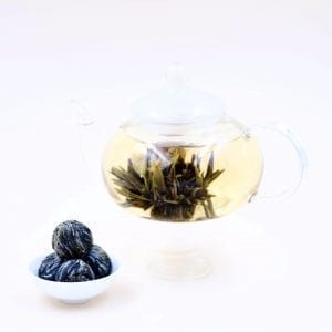 roleaf riches wealth blooming tea in tea pot and plate