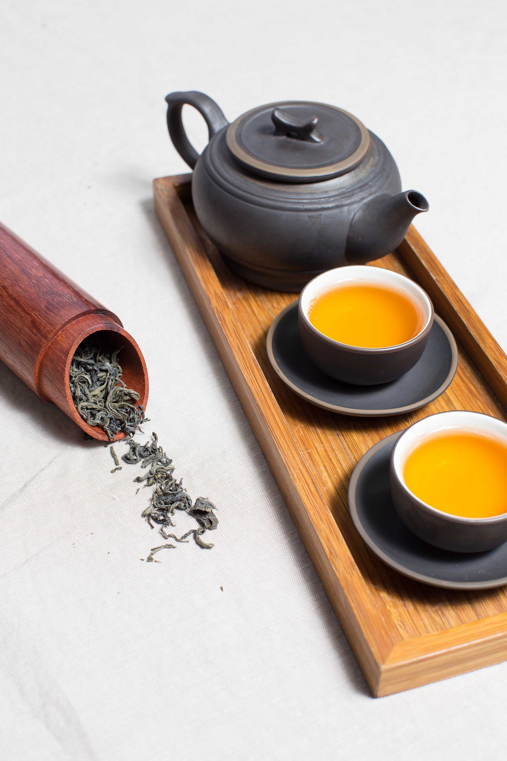 chinese green tea in clay cups in bamboos