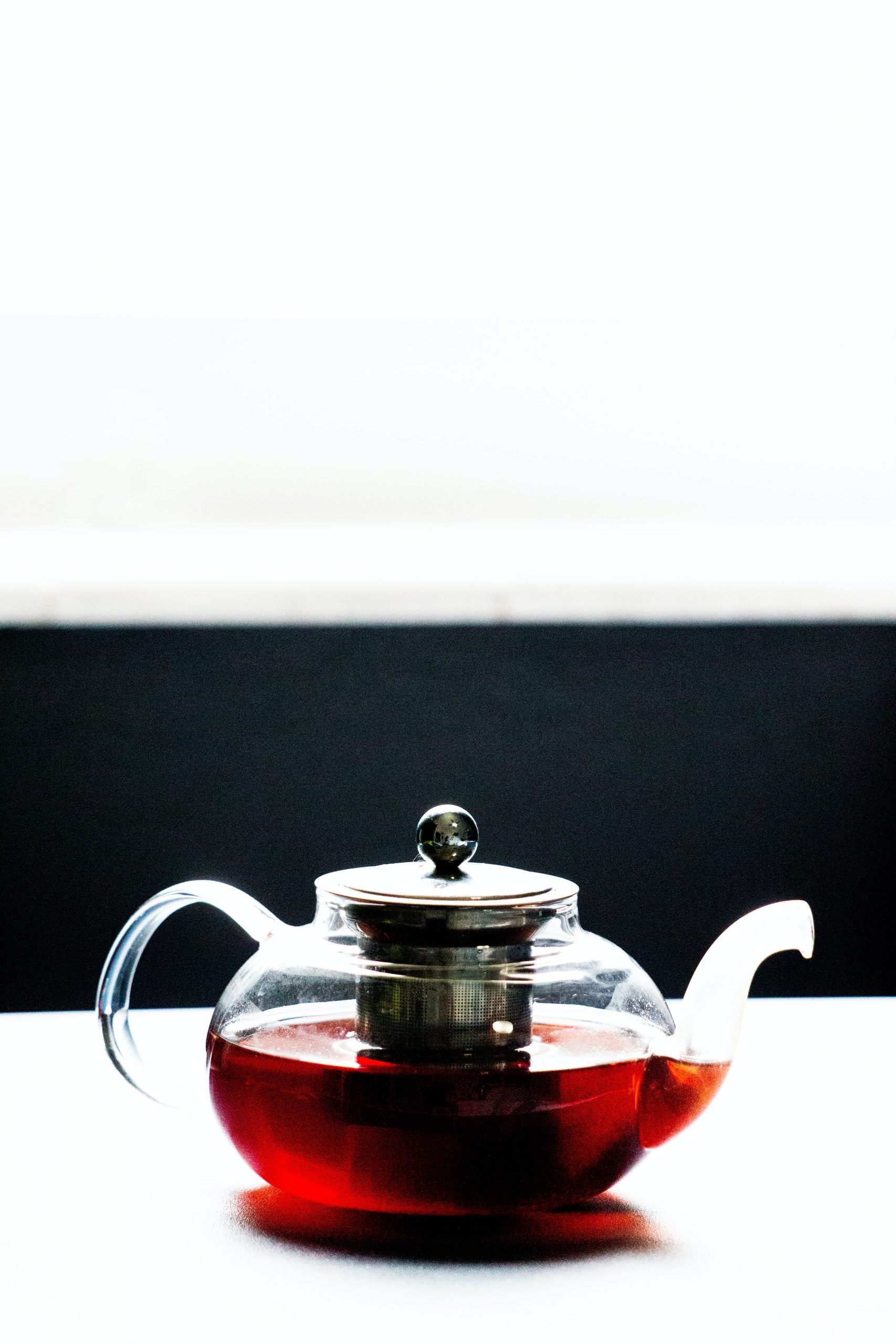 black tea in transparent tea pot